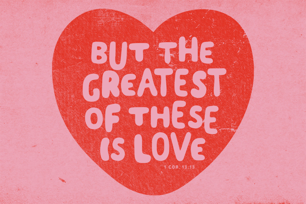 Red heart with white text 'BUT THE GREATEST OF THESE IS LOVE' on a pink background