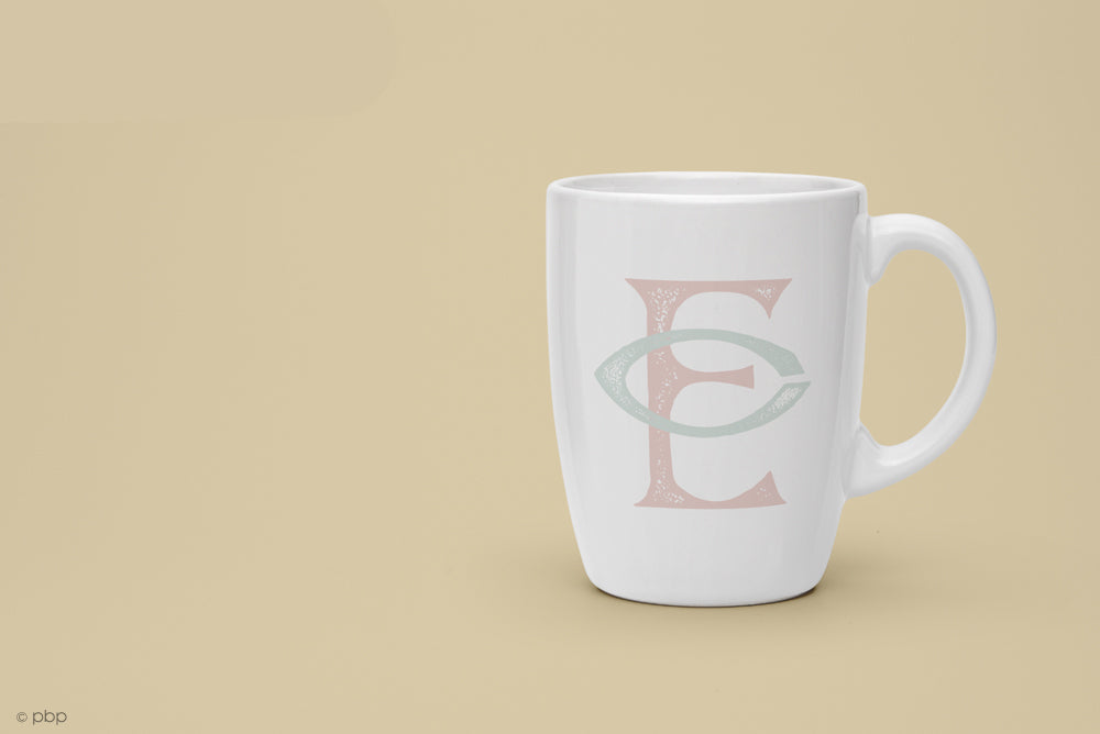 White mug featuring vintage monogram
