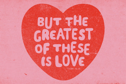 Red heart with white text 'BUT THE GREATEST OF THESE IS LOVE' on a pink background