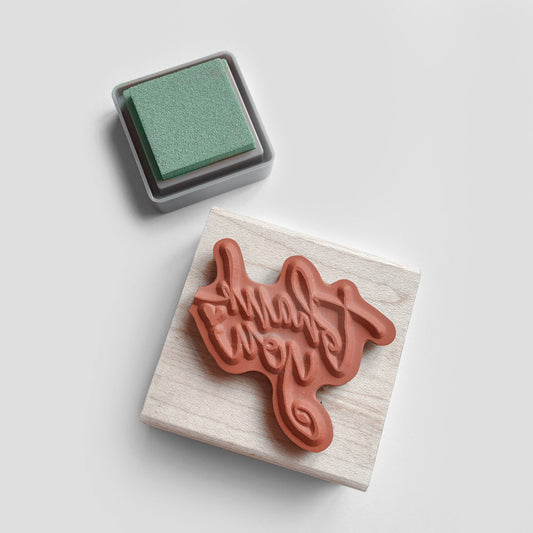 Custom logo stamp in genuine red rubber mounted on a maple wood block

