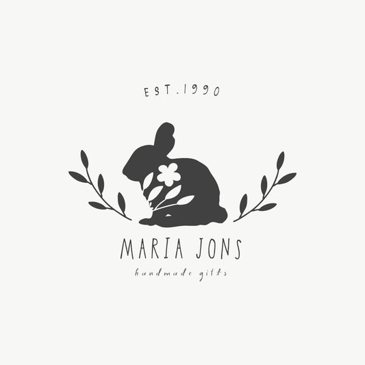 Custom rabbit stamp featuring a floral rabbit illustration with botanical elements and a handwritten font
