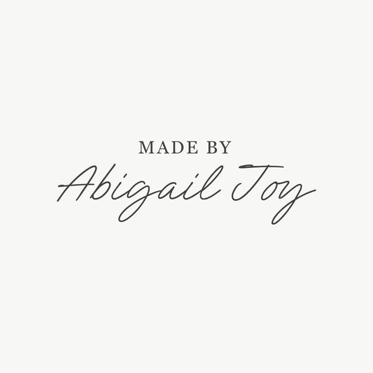 Custom signature stamp featuring "Made by" text with a personalized name in a signature font

