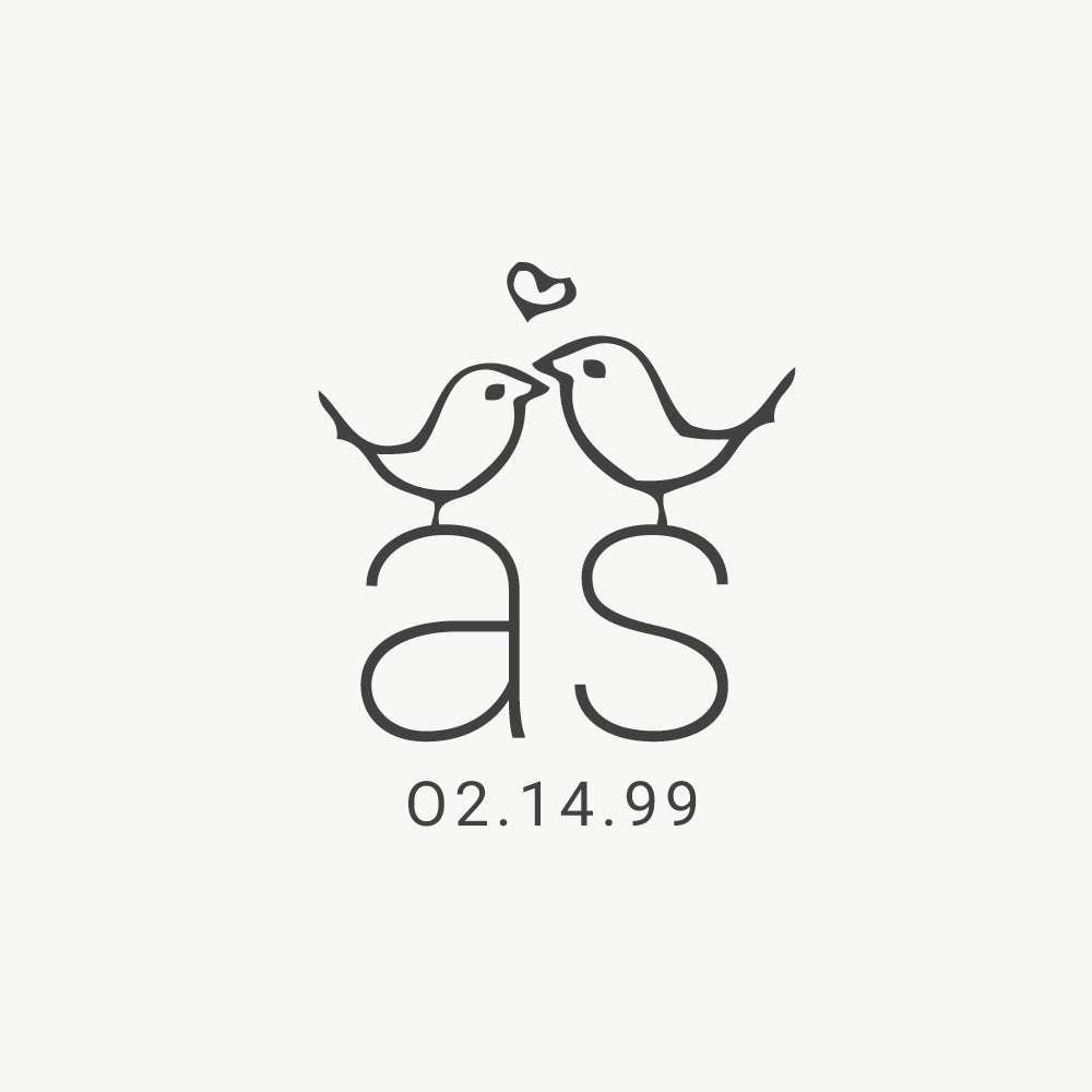 Custom wedding stamp featuring a hand-drawn illustration of love birds and couple’s initials