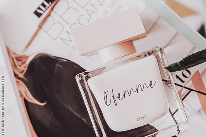 Perfume bottle mockup featuring feminine handwritten script font, available for free download
