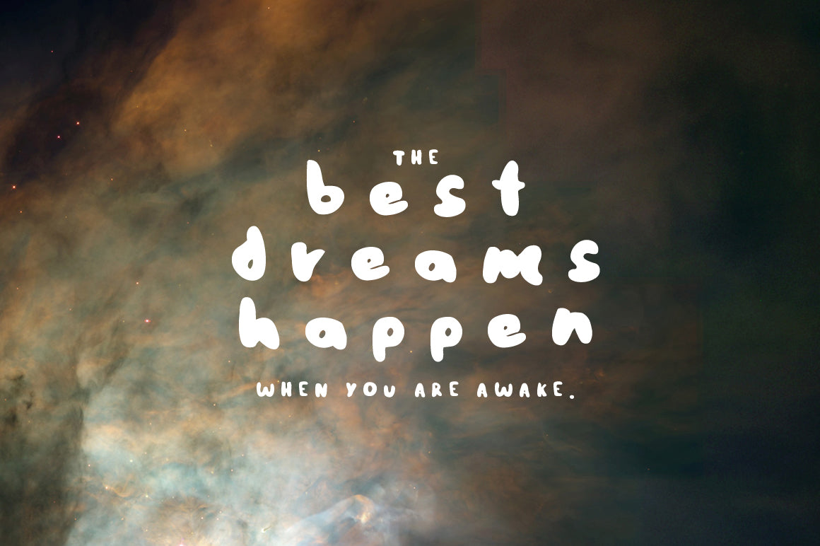 Starry sky with dreams quote featuring hand-painted brush font with playful strokes and a girly vibe, available for free download