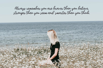 Woman looking the sea with self confidence quote featuring monoline script font with a bouncy baseline, available for free download
