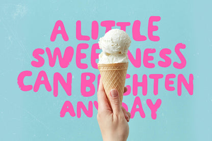 Ice cream cone held by a hand with pink sweet quote on a light blue background

