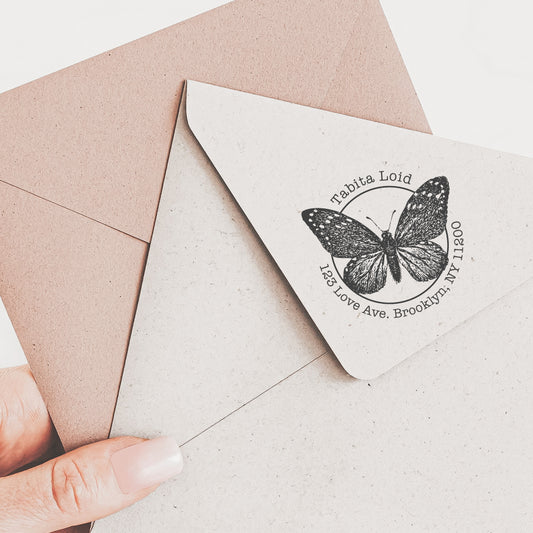 Return address stamp featuring a vintage butterfly illustration with a vintage font
